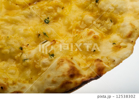 Naan with cheese and garlic Naan with cheese and garlic 12538302