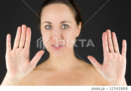 model isolated on plain background stop sign with hands model isolated on plain background stop sign with hands 12542668