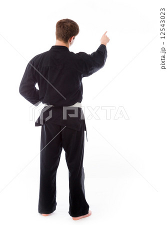 model isolated on plain background back pointing model isolated on plain background back pointing 12543023