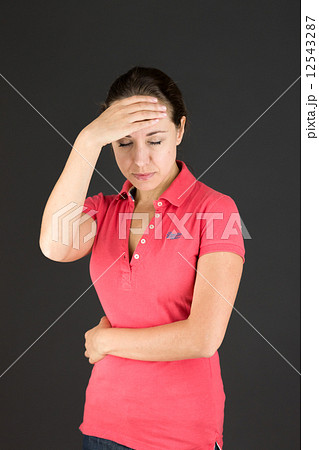 model isolated on plain background confused headache model isolated on plain background confused headache 12543287