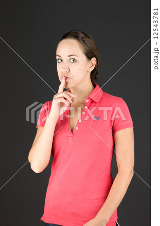 model isolated with finger on lips secret 12543781
