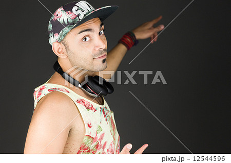 model isolated on plain background looking at camera pointing model isolated on plain background looking at camera pointing 12544596