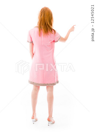 model isolated on plain background back pointing 12545021