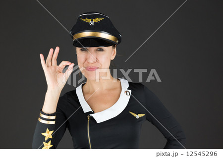 model isolated on plain background hand gesture ok sign 12545296