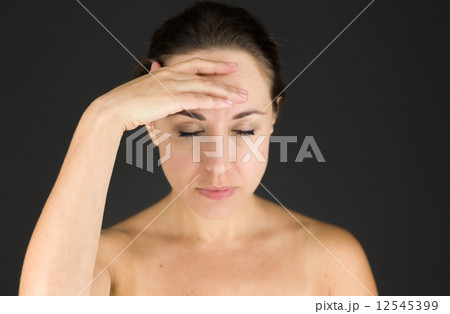 model isolated on plain background confused headache model isolated on plain background confused headache 12545399