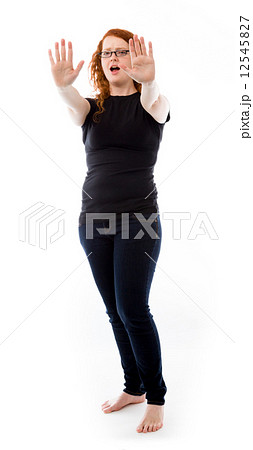 model isolated on plain background stop sign with hands model isolated on plain background stop sign with hands 12545827