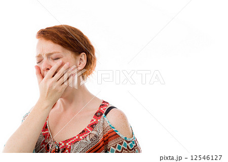 model isolated on plain background tired bored yawning 12546127