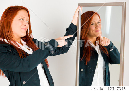 model isolated on plain background pointing to herself model isolated on plain background pointing to herself 12547343