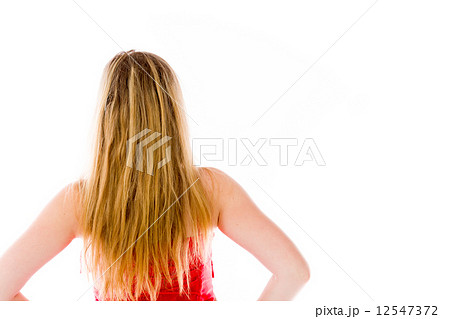 model isolated on plain background back hands on hips model isolated on plain background back hands on hips 12547372