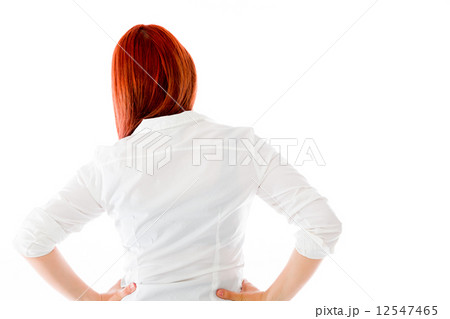 model isolated on plain background back hands on hips 12547465