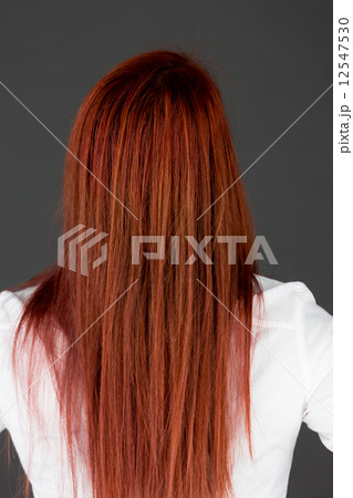 model isolated on plain background back hands on hips model isolated on plain background back hands on hips 12547530