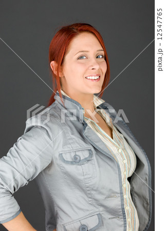 model isolated on plain background pround confident hands on hip 12547765