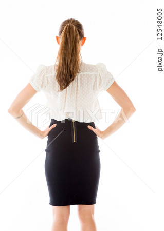 model isolated on plain background back hands on hips 12548005