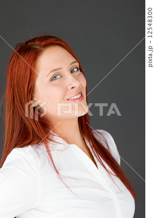 model isolated on plain background pround confident hands on hip 12548300