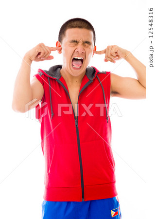 model isolated on plain background plugging ears with fingers 12548316