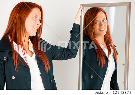 model isolated on plain background happy smiling arms crossed 12548372