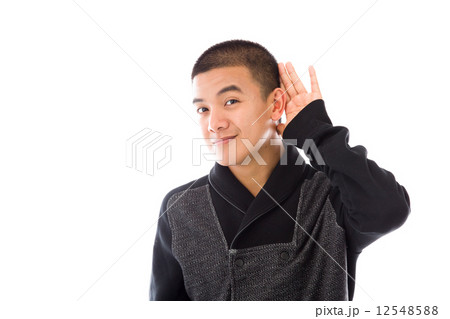 model isolated on plain background listening paying attention 12548588