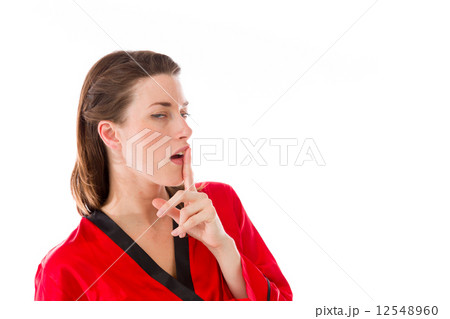 model isolated with finger on lips secret 12548960