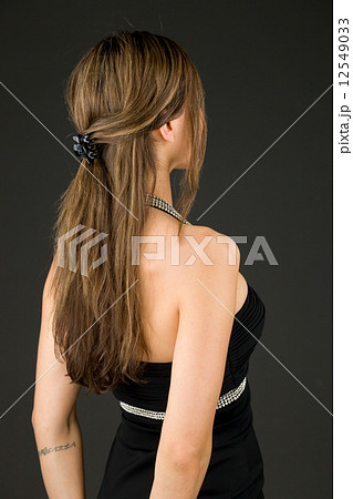 model isolated on plain background back looking behind model isolated on plain background back looking behind 12549033