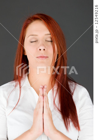 model isolated on plain background praying wishing model isolated on plain background praying wishing 12549216
