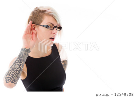 model isolated on plain background listening paying attention 12549508