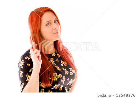 model isolated with fingers crossed for luck 12549876