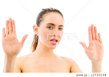 model isolated on plain background stop sign with hands model isolated on plain background stop sign with hands 12550148