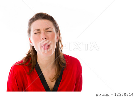 model isolated on plain background face sticking tongue out 12550514