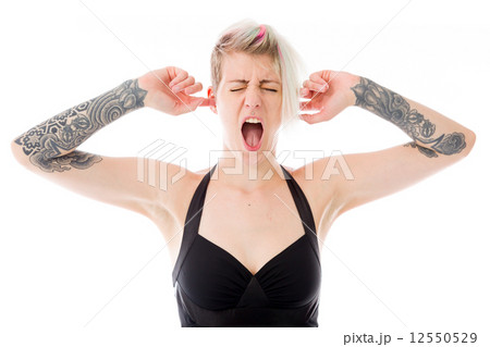 model isolated on plain background plugging ears with fingers 12550529
