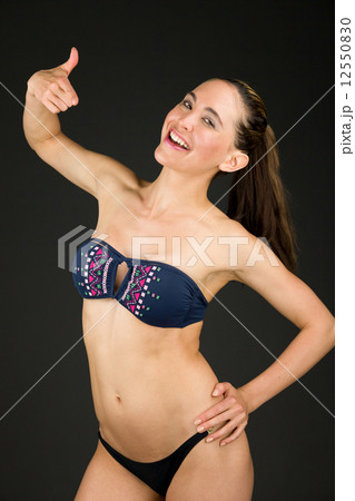 model isolated on plain background pointing to herself model isolated on plain background pointing to herself 12550830
