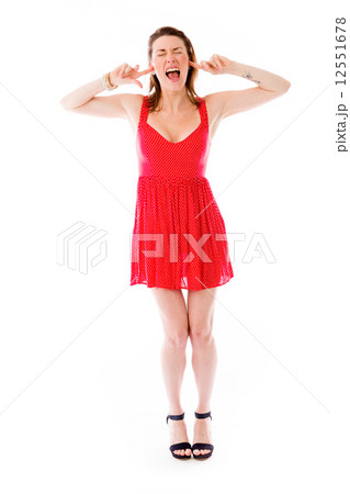 model isolated on plain background plugging ears with fingers 12551678