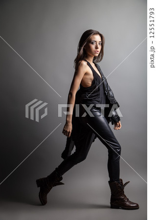 Fashion model wearing leather pants and jacket Fashion model wearing leather pants and jacket 12551793