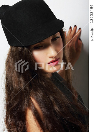 Vintage. Romantic Pensive Woman in Black Hat 12552494