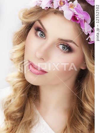 Charming Girl in Wreath of Flowers Charming Girl in Wreath of Flowers 12552502