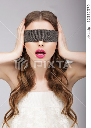 Confusion. Woman holding Headband on her Head Confusion. Woman holding Headband on her Head 12552570