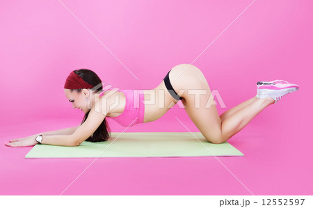 Healthy Lifestyle. Sporty Woman Exercising in Aerobics' Room 12552597