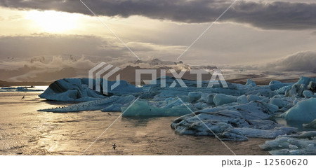 Sunset at the famous glacier lagoon at Jokulsarlon in Iceland 12560620