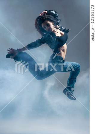 Brunett dancer. Woman dancing in a studio 12561572