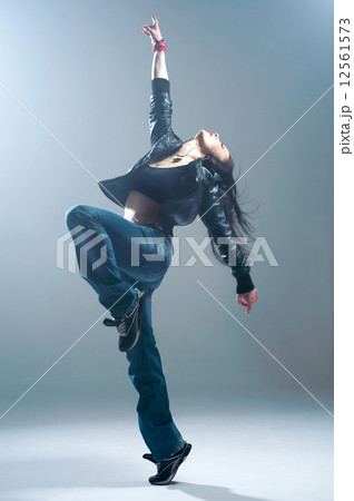 Brunett dancer. Woman dancing in a studio 12561573