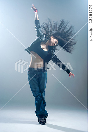 Brunett dancer. Woman dancing in a studio 12561574