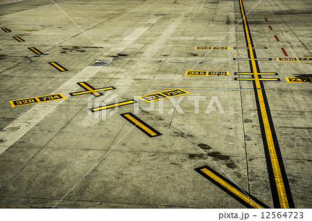 black and yellow airport markings on concrete black and yellow airport markings on concrete 12564723