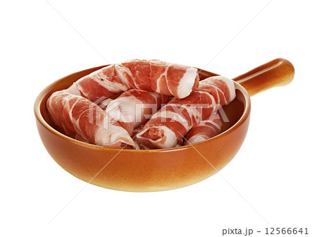 sausages wrapped in bacon in a frying pan, chevapchichi on white background 12566641