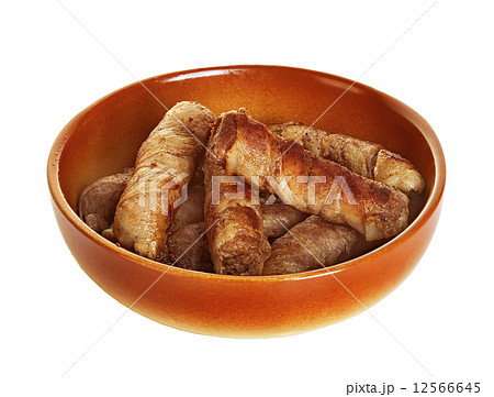 sausages wrapped in bacon in a frying pan, chevapchichi on white background 12566645