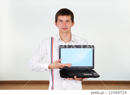 boy holding laptop boy holding laptop 12569724