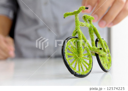 Hand Holding Eco bicycle icon concept Hand Holding Eco bicycle icon concept 12574225