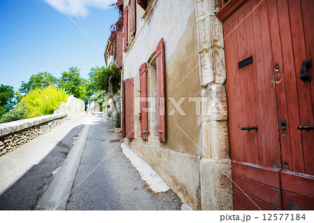 Provencal street with typical houses in southern France, Provenc Provencal street with typical houses in southern France, Provenc 12577184