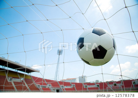 Soccer ball in the goal after shooted 12578378