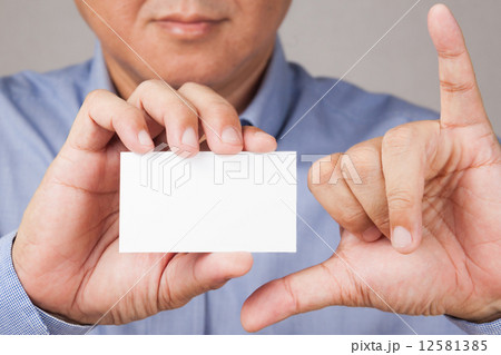 Business man holding with thumb and pinky gesture Business man holding with thumb and pinky gesture 12581385