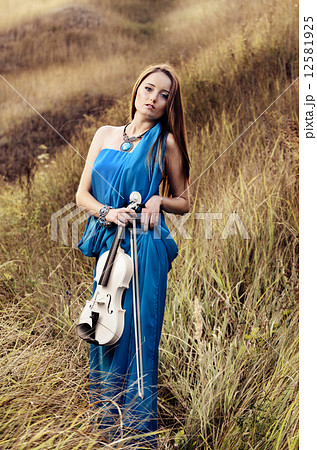 Young woman playing violin Young woman playing violin 12581925