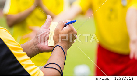 Referee soccer show card for warning and  recorded player foul Referee soccer show card for warning and  recorded player foul 12583612